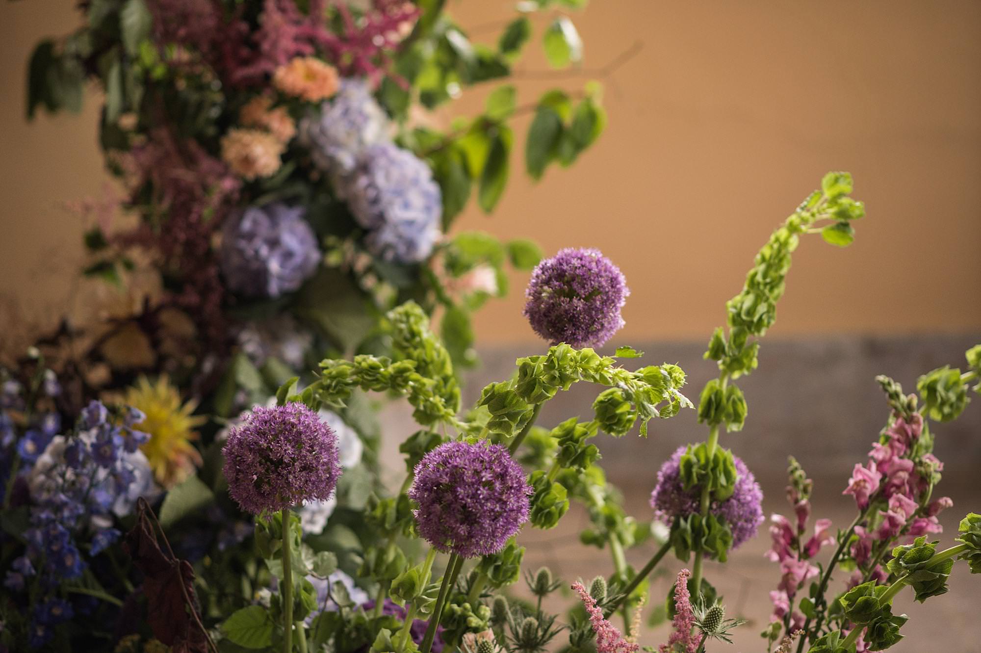 Alter piece flowers at the top of the aisle by Wreath & WIld
